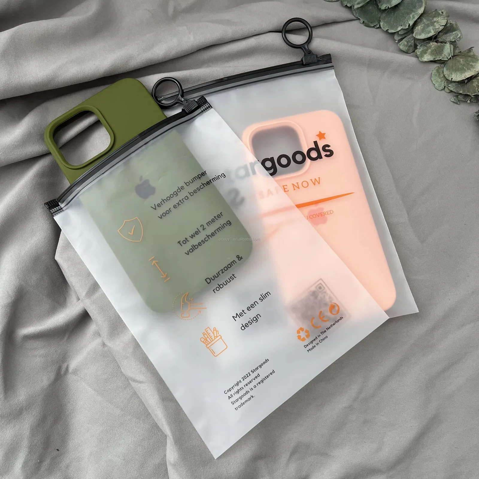 Custom phone cases in frosted zip pouches with printed insert cards behind them and hang rings at the top