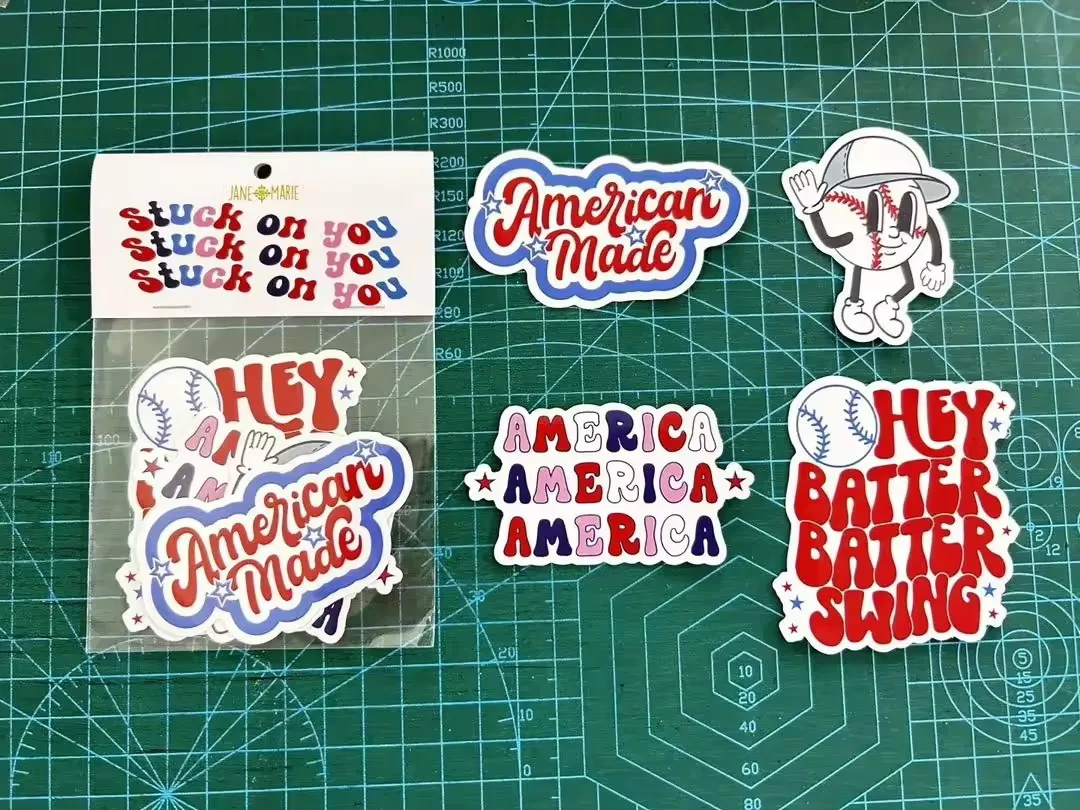 Sticker pack with a white printed header card with a round hang hole, sealed over a clear bag of die-cut stickers