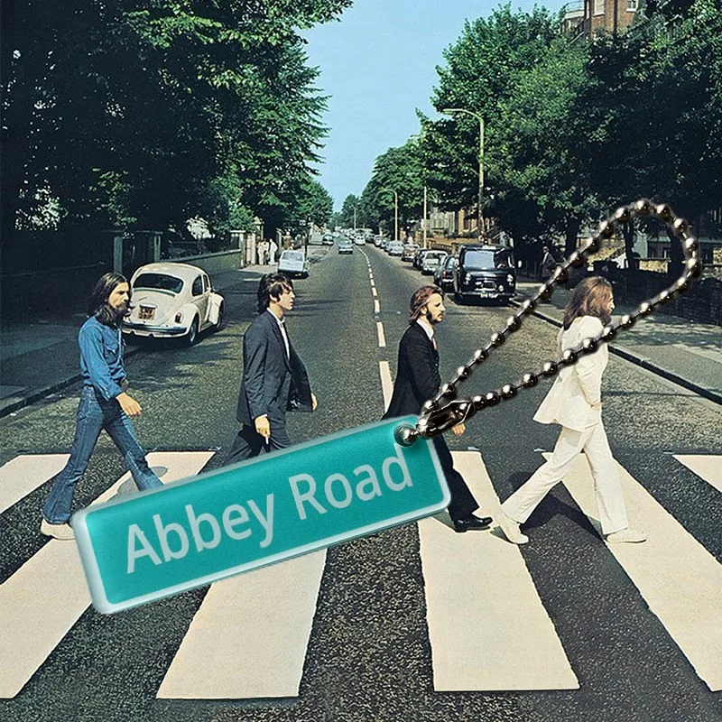 Green street-sign shaped acrylic keychain reading Abbey Road on a ball chain