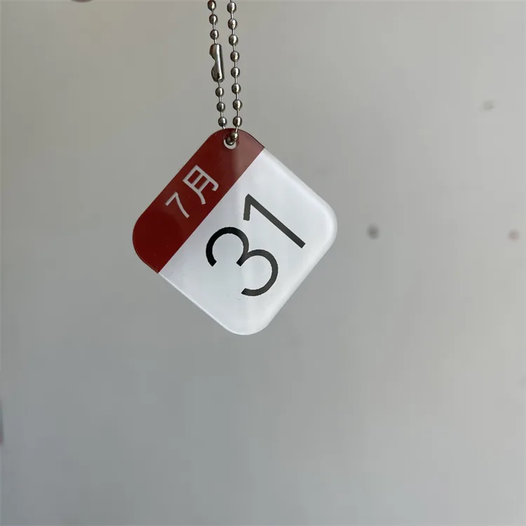 Square acrylic keychain with calendar artwork under an epoxy dome