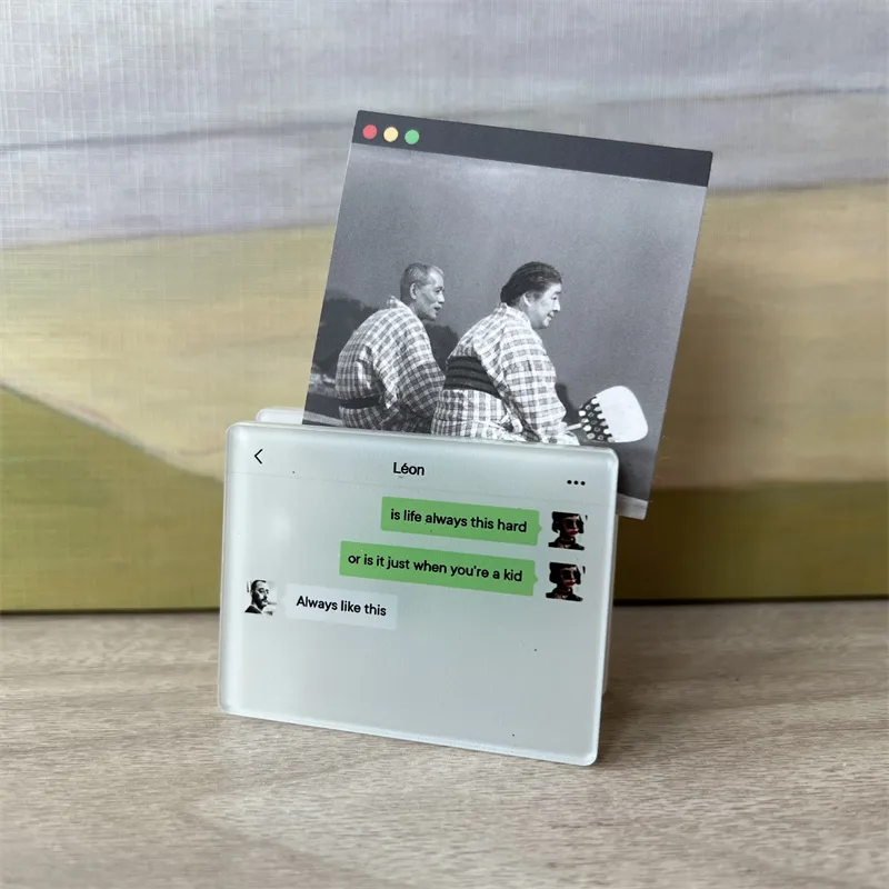 Clear acrylic photo-insert magnet holding a printed photo, standing upright