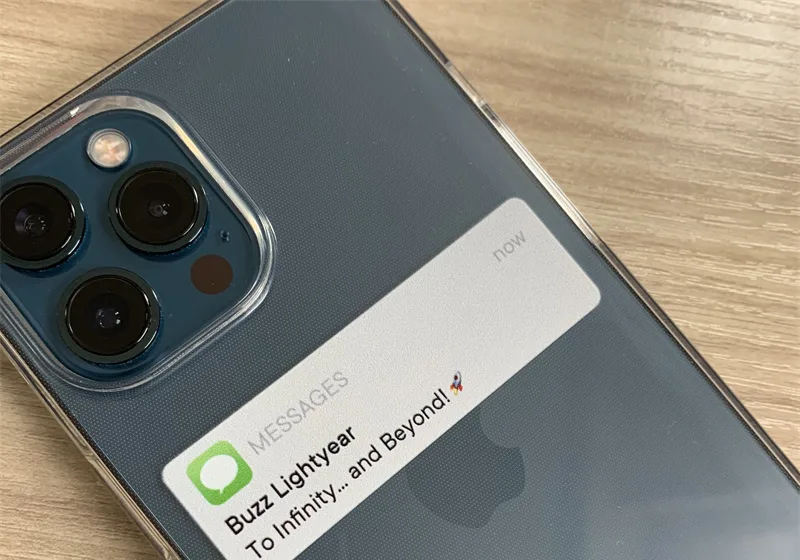 Printed notification-banner design on a clear case, placed below the camera module so the print clears the cutout