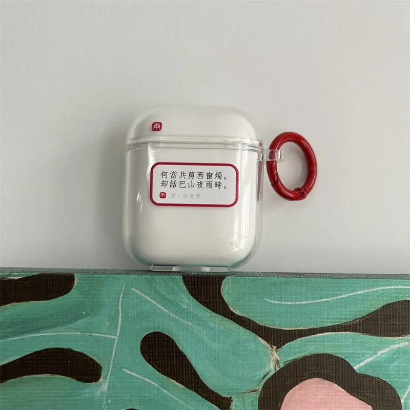 White AirPods case with a small printed quote sticker applied